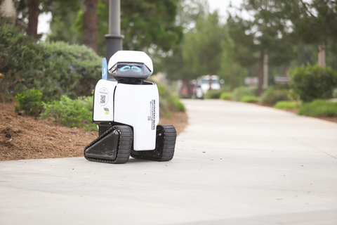 Daxbot ADA Sidewalk Assessment Robot waits on a street corner