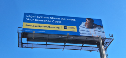 Brick-and-mortar billboards highlighting the impact of legal system abuse can be found in both localities.