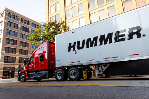 A Hummer truck moves through the city streets; a visible reminder of the people, performance, and professionalism behind every mile we run.