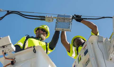 original Comcast technicians install advanced broadband infrastructure as the company expands Internet access across Florida.