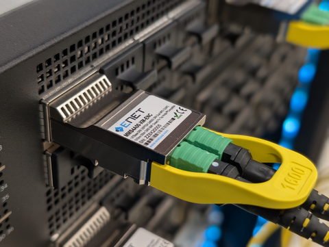 ENET 1.6T DR8 OSFP224 transceiver in NVIDIA switch. 1600G Octal Small Form-factor Pluggable (OSFP) optical module with top closed fin designed for 500m optical communication applications. The ENET 1.6T DR8 converts 8 channels of 200Gb/s (PAM4) electrical input data to 8 channels of parallel optical signals via integrated silicon photonics optical path, each capable of 200Gb/s operation for an aggregate data rate of 1600Gb/s. On the receiver side, the module converts 8 channels of parallel optical signals of 200Gb/s each channel for an aggregate data rate of 1600Gb/s into 8 channels of 200Gb/s (PAM4) electrical output data. MSA and NVIDIA compatible.