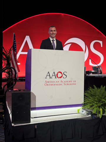 New HSS research highlights the use and advantages of osseointegration for individuals with an amputation. Taylor J. Reif, MD, orthopedic surgeon in the Osseointegration Limb Replacement Center at HSS, is pictured presenting the research at the 2026 Annual Meeting of the American Academy of Orthopaedic Surgeons.