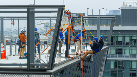 Participants rappel down a building during last year's Over the Edge fundraising event at Reston Station.