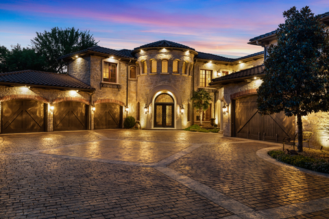 original Tuscan-inspired estate spans 10 acres and includes a car collector’s dream auto showroom, outdoor-indoor pool, panoramic views, landscaped grounds and an equestrian barn, all within 40 miles of downtown Dallas, Texas (Photo Credit: Camila Will Photography).