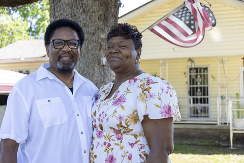 original A U.S. Army Reserve veteran stands outside his home where major repairs were completed thanks to a $15,000 Housing Assistance for Veterans (HAVEN) grant from FHLB Dallas, provided through FBT Bank & Mortgage.