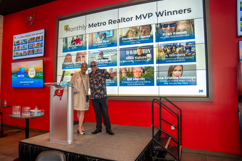 original Julie Goforth Birch, Realtor Liason, poses with Ryan Kessell, one of the winners at the Metro MVP event.
