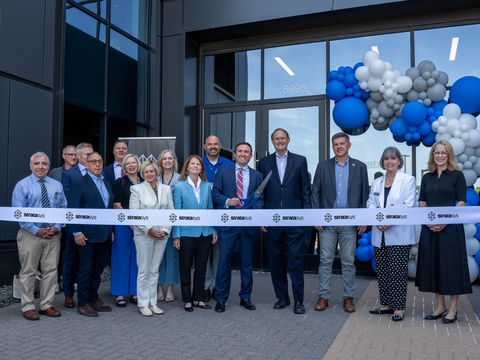 original Ribbon-cutting ceremony at the grand opening of Stratasys’ Americas Regional Corporate Headquarters in Minnetonka, Minnesota, with Stratasys leaders, partners, and community guests, including Rich Garrity, Scott and Lisa Crump.
