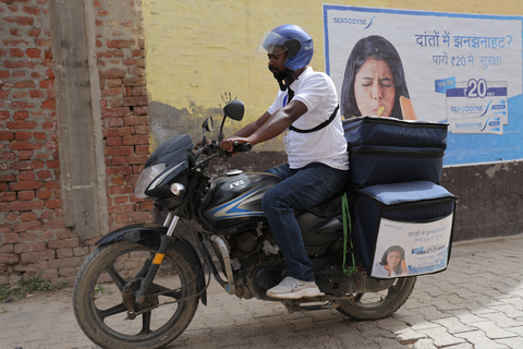 Haleon Health Ambassador on motorbike, equipped with testing kits, samples and diagnostic tools