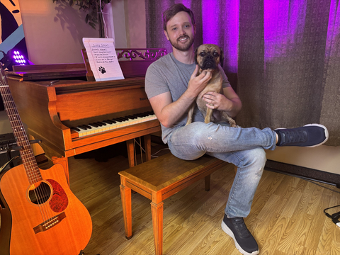 original Jake Woodruff holds his dog Pablo, whom he adopted at a BOBS pet adoption event in 2024. Pablo’s companionship has helped Woodruff with his neurodivergent challenges – reducing his anxiety, keeping him active and helping him interact with others.