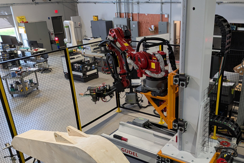 original Güdel adds two additional degrees of freedom to heavy-duty robotic grinding applications through its TrackMotion Vertical (TMV) and TrackMotion Floor (TMF) systems. This allows a single robot to maintain consistent contact pressure and path speed across massive surfaces that would otherwise require multiple robots or complex part repositioning. Photo credit: Titan Robotics
