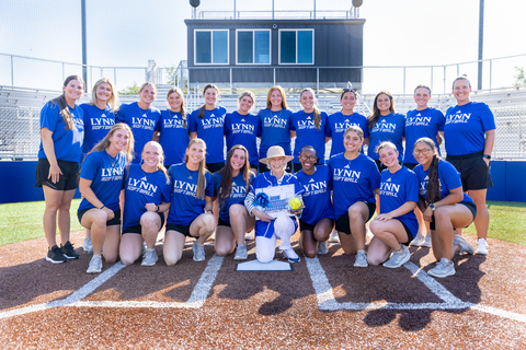 original Tish Messinger and the Lynn University 2025-26 Softball team in the new Tish Celenza Messinger Stadium.