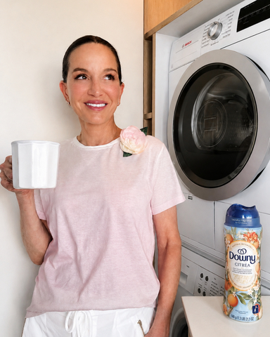 Fashion designer Cynthia Rowley, wearing her limited-edition Downy Boutique Botanicals brooch alongside the collection that inspired it.