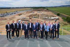 Liebherr and Rehlko celebrate the strategic capacity expansion of Liebherr-Components Colmar factory. From left to right: Brian Melka (President and CEO of Rehlko), Jan Liebherr (President of the Administrative Board of Liebherr-International AG), Pietro Iemmi (CEO Liebherr-Component Technologies AG), and further members of Rehlko's and Liebherr's management.