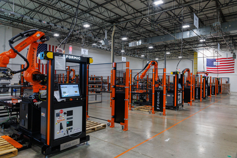 original A row of Formic palletizers ready for delivery to customer facilities across the United States.