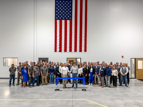 original Akumin and MHI team members cut the ribbon on a new factory to produce Akumin AXIS units.