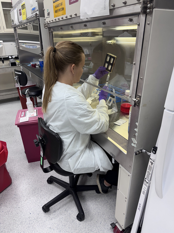 Rachel Nordberg, Phd, from the Deltai lab at UC Irvine, prepping the BioServe device before it goes into orbit.