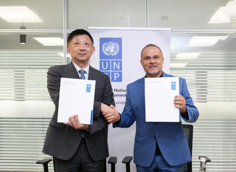 original TAILG President Michael Yao signs the MOU with Jean-Luc Stalon (PhD), Resident Representative of UNDP Kenya.