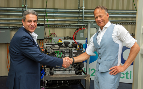 Yuval Bachar, founder and CEO of ECL (left) and Richard Berkling, CEO of PowerCell Group (right), shake hands upon the completion of a strategic partnership to deploy industrial-grade hydrogen fuel cell power across ECL's AI data center platform. The agreement comprises a firm purchase order for PowerCell PS190 fuel cell systems, alongside a separate non-binding memorandum of understanding between ECL and PowerCell for approximately 300 MW of additional hydrogen fuel cell capacity as ECL expands its FlexGrid data center footprint. A PowerCell hydrogen fuel cell currently deployed in production at ECL's MV-1 data center in Mountain View, Calif. is in the background.