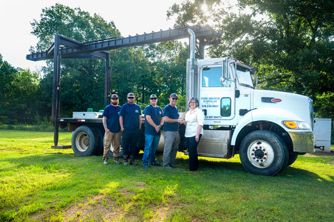original Moore Brothers Pumping owners with Community Bank of Louisiana Branch Manager Tracy Garcie, far right, after acquiring a truck, made possible with an FHLB Dallas SBB loan provided through Community Bank of Louisiana.