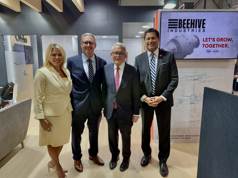original Leaders gather at the Farnborough International Airshow to announce Beehive Industries' $70 million expansion in Southwest Ohio. From left to right: Kimm Lauterbach, President and CEO of REDI Cincinnati; Gordie Follin, Chief Product Officer at Beehive Industries; Mike DeWine, Governor of Ohio; and J.P. Nauseef, President and CEO of JobsOhio.