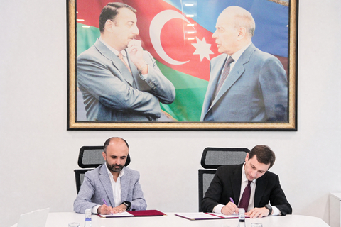 original Yagub Rahimov, CEO and Founder of Polygraf AI, and Farid Osmanov, Chairman of IDDA, signing the MOU