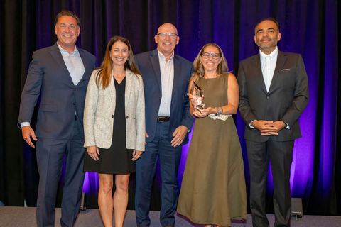Ioana Cozmuta, Founder and CEO of G-SPACE, accepts the third annual Joseph C. Belden Innovation Award. From left: Bart Giordano, SVP and President, RUCKUS Networks; Leah Tate, Chief People and Strategy Officer, Belden; Brian Lieser, Chief Commercial Officer, Belden; Cozmuta; and Dr. Ashish Chand, President and CEO, Belden.