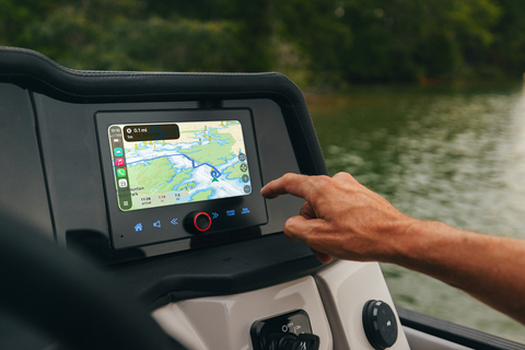 original Savvy Navvy navigation displayed through Apple CarPlay at the helm of a Crest pontoon, delivering seamless on-water navigation and route planning.