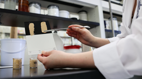 Foundation shades are evaluated as part of color science research.
