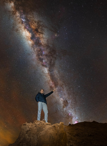 original Fermi Explorer Co-Founder & President, Philip Johnston, pointing at the exact star, Alpha Centauri, the target of the mission, with the Milky Way in view. Taken July, 2026 by astrophotographer, Alexis Trigo, in the Atacama Desert, Chile, with 20-second exposure.