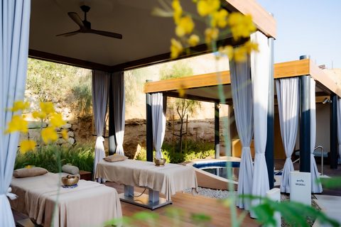 Outdoor relaxation area at Jayasom Wellness Resort AMAALA, where serene design and sea-facing spaces create a setting for rest and renewal.