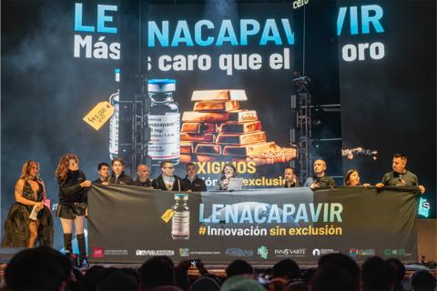 original Dr. Patricia Campos (middle), AHF Bureau Chief for Latin America & the Caribbean, speaks to attendees at a World AIDS Day concert in Mexico City on Nov. 29, 2025, about the importance of holding Gilead accountable for keeping lenacapavir out of reach of most countries in the region.