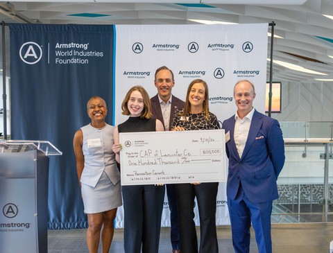 Leaders from Armstrong World Industries, including CEO Mark Hershey, present a check on behalf of the Armstrong World Industries Foundation to Community Action Partnership of Lancaster County, an organization dedicated to helping families achieve economic mobility and stability, during the inaugural Armstrong World Industries Community Impact Celebration.