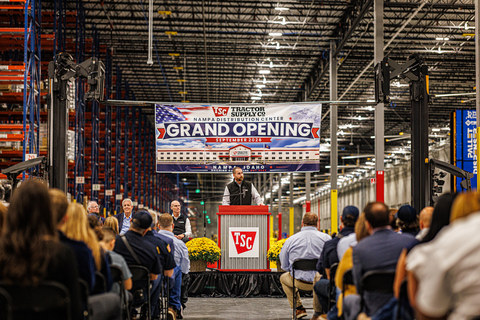 Craig Ledbetter, Chief Supply Chain Officer of Tractor Supply, addresses the audience during the grand opening event. From left to right, Ledbetter is accompanied on stage by Idaho Department of Commerce Director Tom Kealey, Nampa Mayor Darl Bruner and Nampa Distribution Center General Manager Steve Legier.