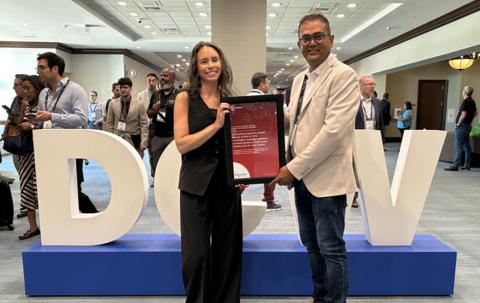 Chanté Maurio, vice president of Data Centers, Global and Strategic Accounts at UL Solutions, presents a certificate to Manav Patel, vice president of Strategy and Transformation for Schneider Electric’s Low Voltage Business, recognizing the first UL 2140 certification for prefabricated data center power distribution assemblies at Data Center World Power on Sept. 22 in Dallas.