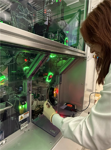 South 8 Technician inspects an AE35 cell.