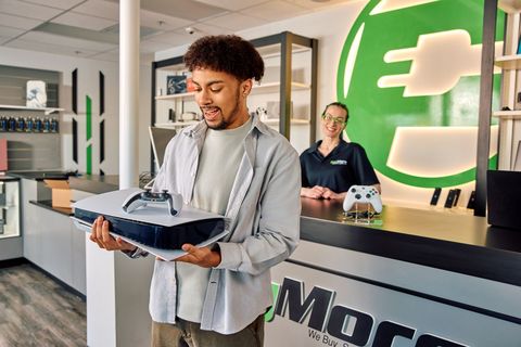 original A customer sells a gaming console at a PayMore store. PayMore buys and sells gaming systems and other consumer electronics at locations across the U.S. and Canada.