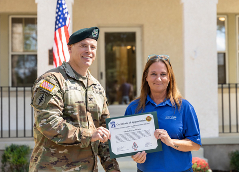 thumbnail Corvias Maintenance Manager Liz Mitchell accepts an award for outstanding support of Fort Bragg families.