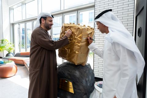 original H.E. Faisal Al Bannai, Secretary General of the Advanced Technology Research Council (ATRC), and H.E. Belhoul Al Falasi, Chairman of the UAE Space Agency, sign a model of the UAE-built probe developed by the Technology Innovation Institute (TII) for the Emirates Mission to the Asteroid Belt (EMA). The probe was designed, built and tested in the UAE by TII (Photo: TII)