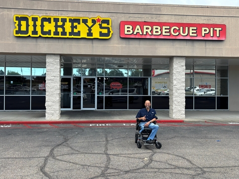 original Robert E. DuBose, Jr., local franchisee and military veteran, outside his Dickey’s Barbecue Pit restaurant in Gulfport, Miss., which is set to reopen October 12.