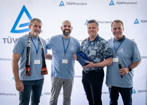 TÜV Rheinland presents the 2026 Excellence in Safety and Sustainability Leadership Award to Teradyne. Pictured from left to right: Kimmo Fuller and Steve Niernberg (TÜV Rheinland), Brad Bombardier (Teradyne), and Jonathan Kotrba (TÜV Rheinland).