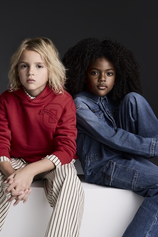 Models wear pieces from the new OshKosh B’gosh x Sergio Hudson collection.