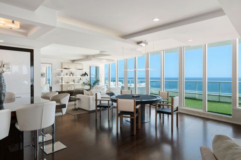 thumbnail Floor-to-ceiling windows frame panoramic Atlantic views from the penthouse’s open living and entertaining spaces, which flow directly onto the expansive terrace. At 7,031 square feet, it is the largest single-level residence currently for sale on Fort Lauderdale Beach. (Photo: 1 OAK Studios)