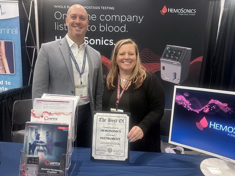 Davis Bland, Business Development & Strategic Partnerships, and Shylah Quast, BSN, RN, Director of Clinical Excellence, accepting the AAST award for Best Instrument on behalf of HemoSonics.